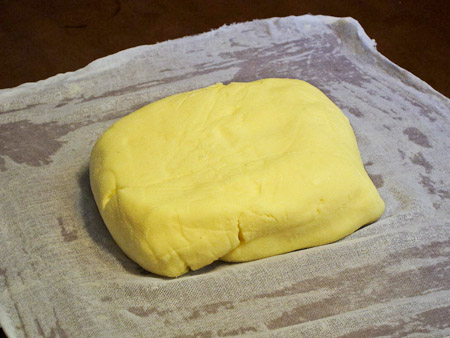 Block butter on cheesecloth